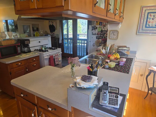 a view of a bedroom with furniture and a large window