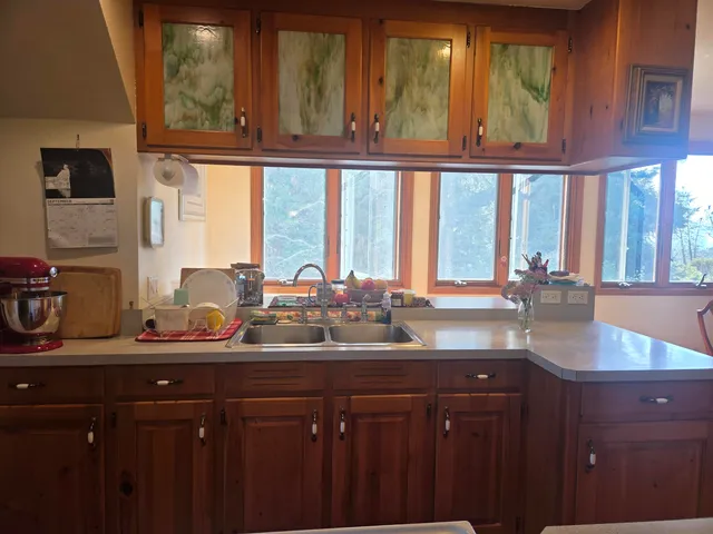 a front view of a house with barbeque seating