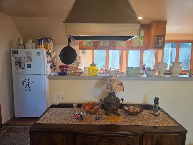 a view of a livingroom with furniture and window