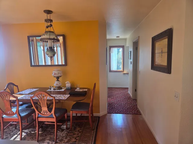 a kitchen with a stove sink and window