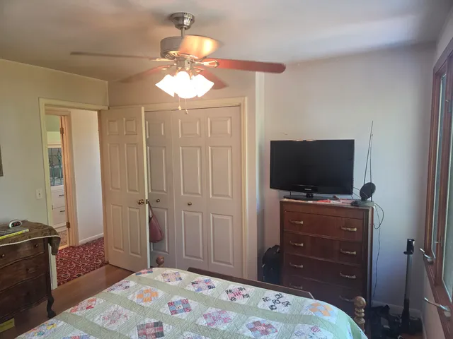 a view of a yard with snow on the road