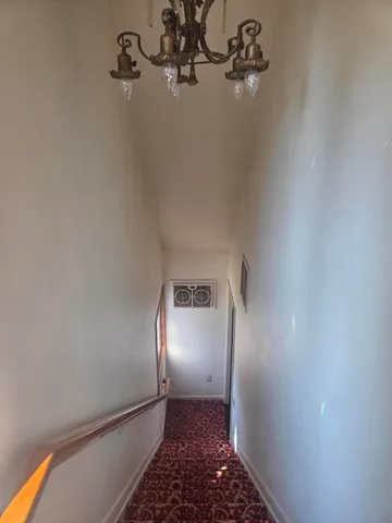 a view of a mirror light fixtures and windows