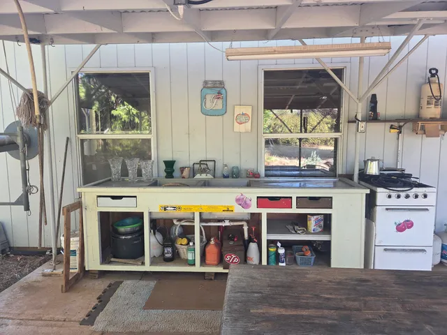 a kitchen with stainless steel appliances granite countertop a stove and a sink
