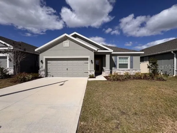 a front view of a house with yard