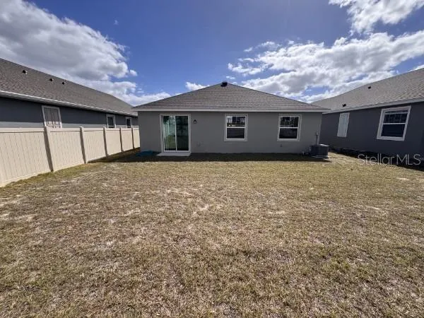 a house view with a backyard space