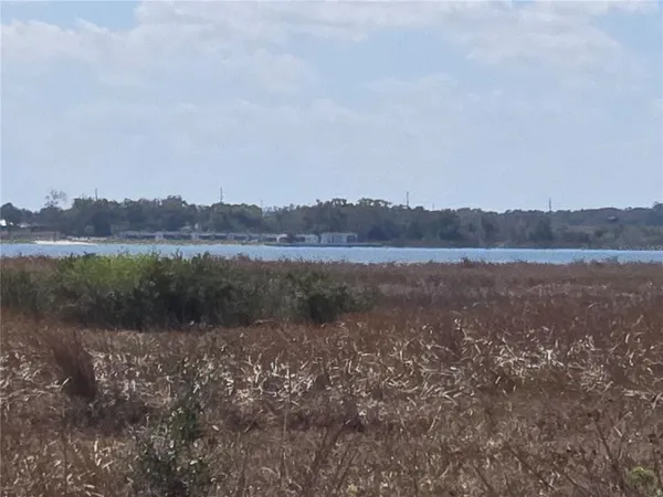 a view of a lake with mountains in the background