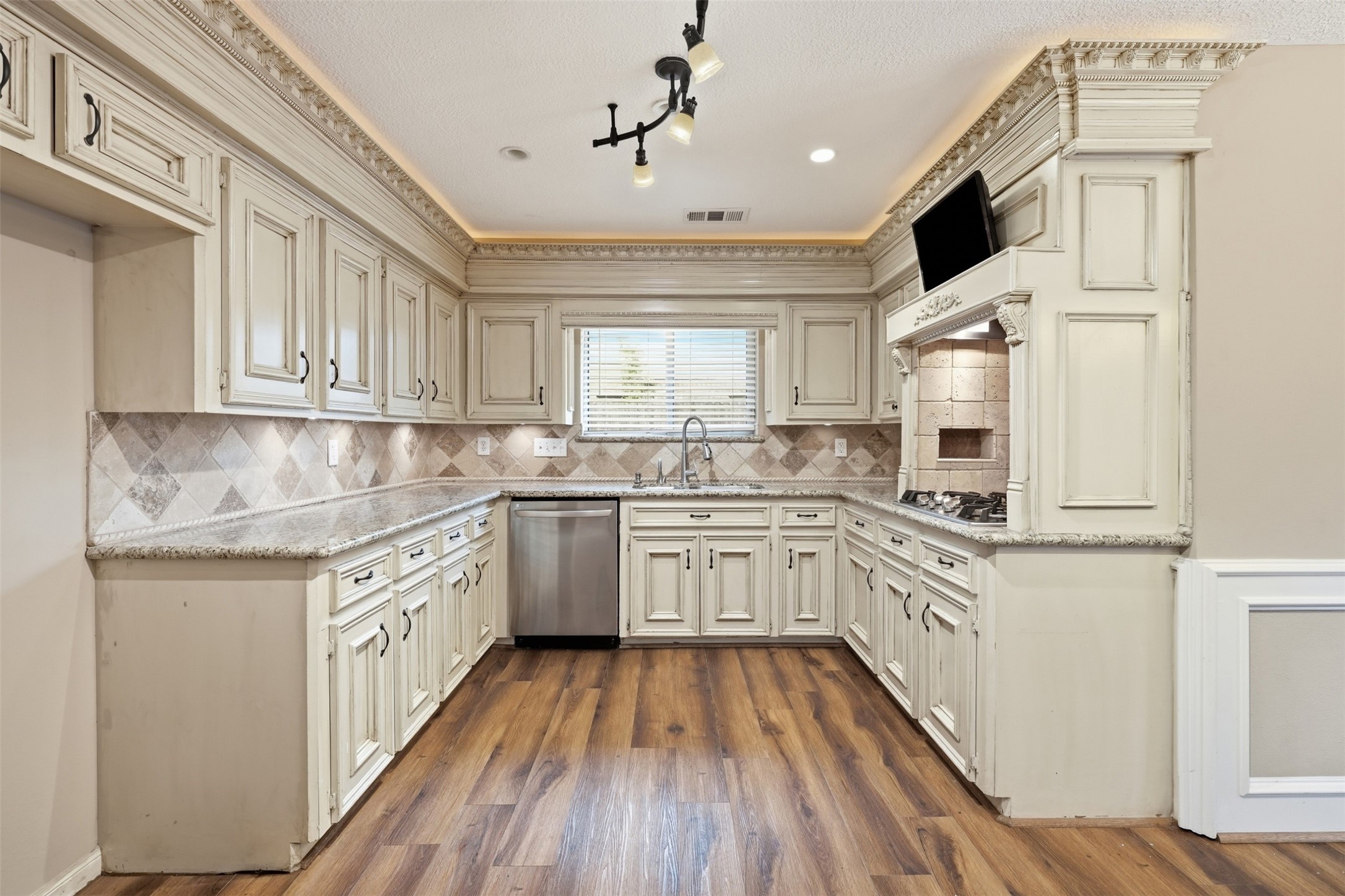 8310 Mentmore Drive Spring, TX 77379 - Photo 16 of 47 The beautifully appointed kitchen offers abundant cabinetry, generous countertop space, and a layout designed for both everyday cooking and entertaining.