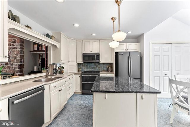 a bedroom with a bed and a television