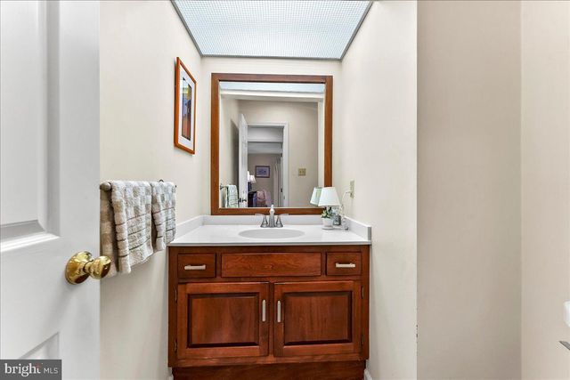 a living room with furniture a rug and a wooden floor