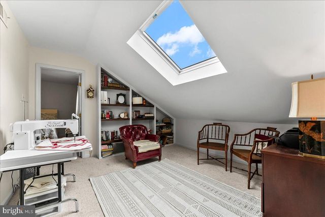 a bedroom with bed and a couch