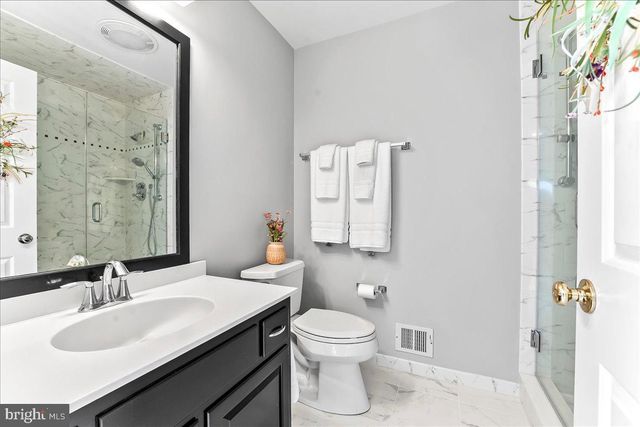 a view of a livingroom with workspace and a window