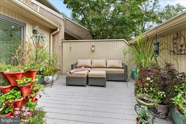a view of entryway with wooden floor and stairs