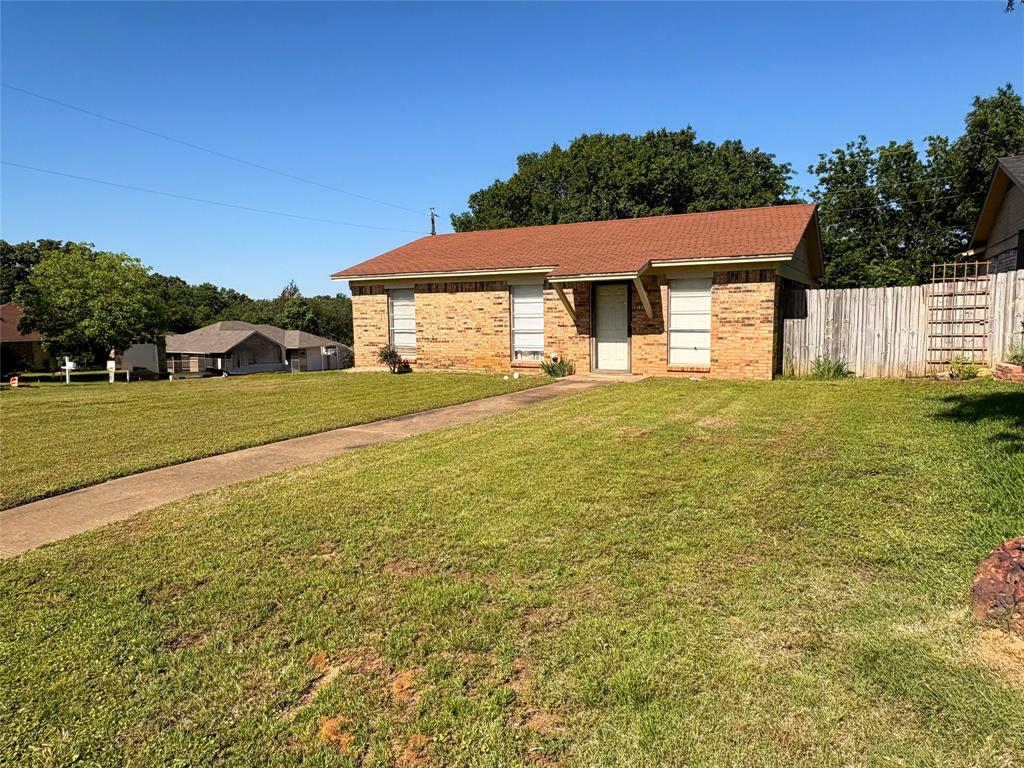 1829 South Center Street Denison, TX 75021 - Photo 3 of 29 a view of a house with a big yard