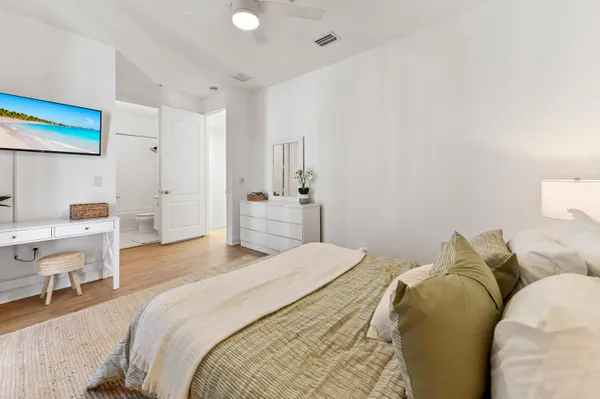 a bedroom with a bed and a chair