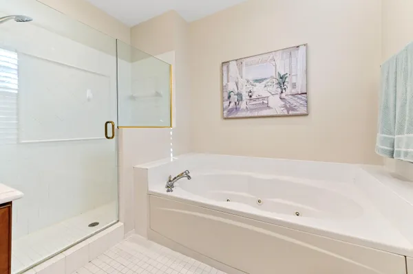a white bath tub and a shower