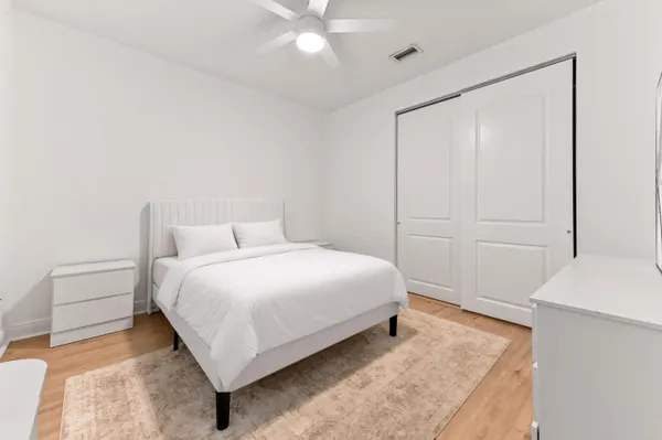 a bedroom with a bed and a cabinets
