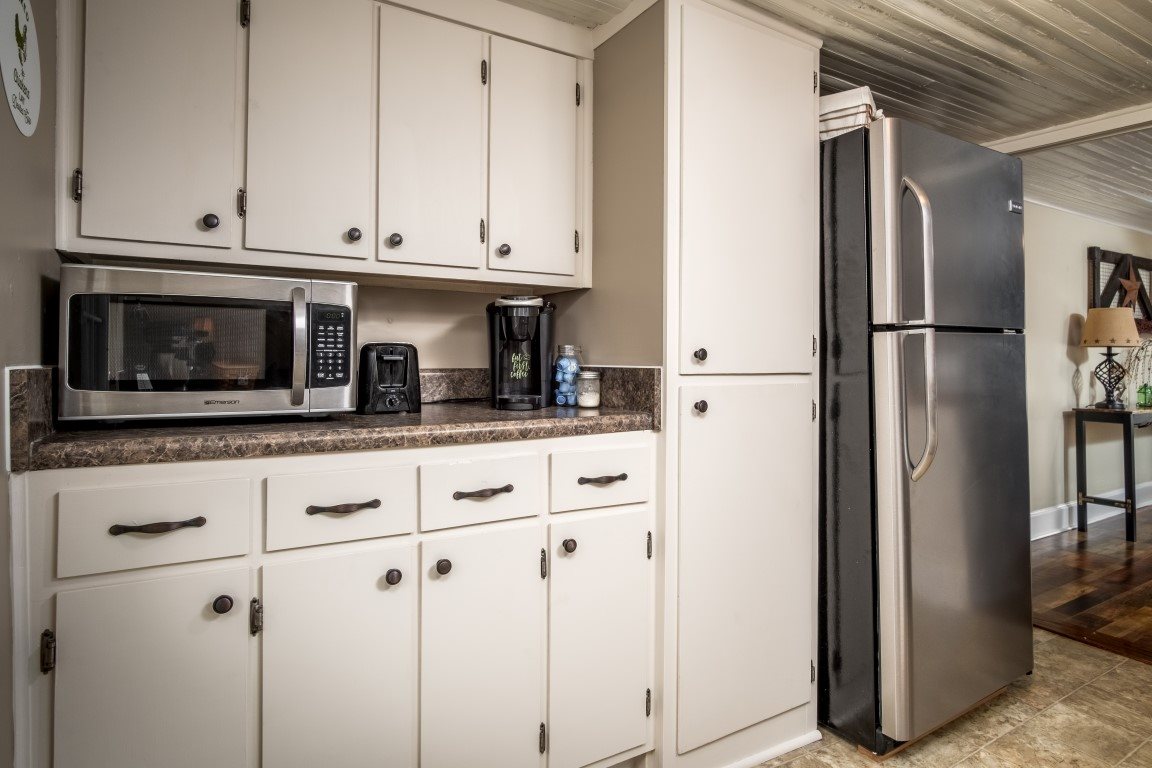 1794 Mt Torrey Road Lyndhurst, VA 22952 - Photo 20 of 44 a kitchen with stainless steel appliances white cabinets and a refrigerator