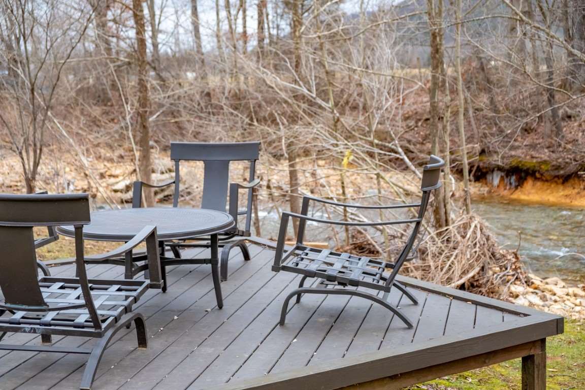 1794 Mt Torrey Road Lyndhurst, VA 22952 - Photo 10 of 44 a view of a roof deck with table and chairs with wooden floor and fence