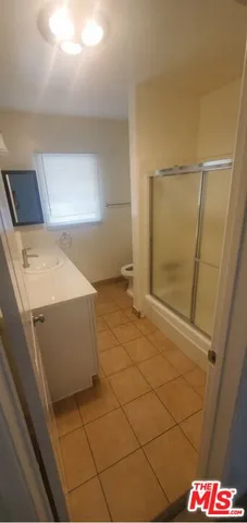 a bathroom with a sink and a shower