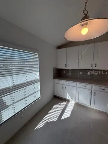 a view of a kitchen with a sink cabinets and a window