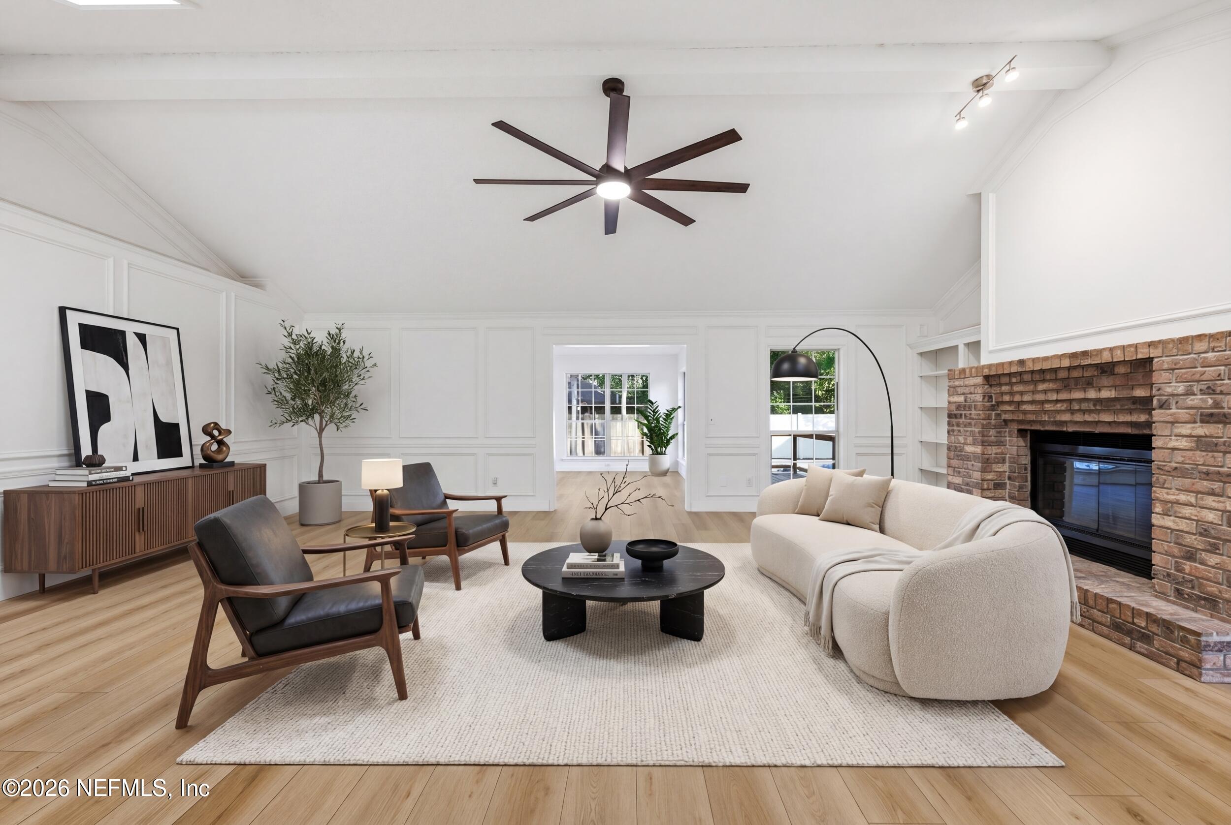 3286 Marbon Road Jacksonville, FL 32223 - Photo 8 of 36 a living room with furniture and a fireplace