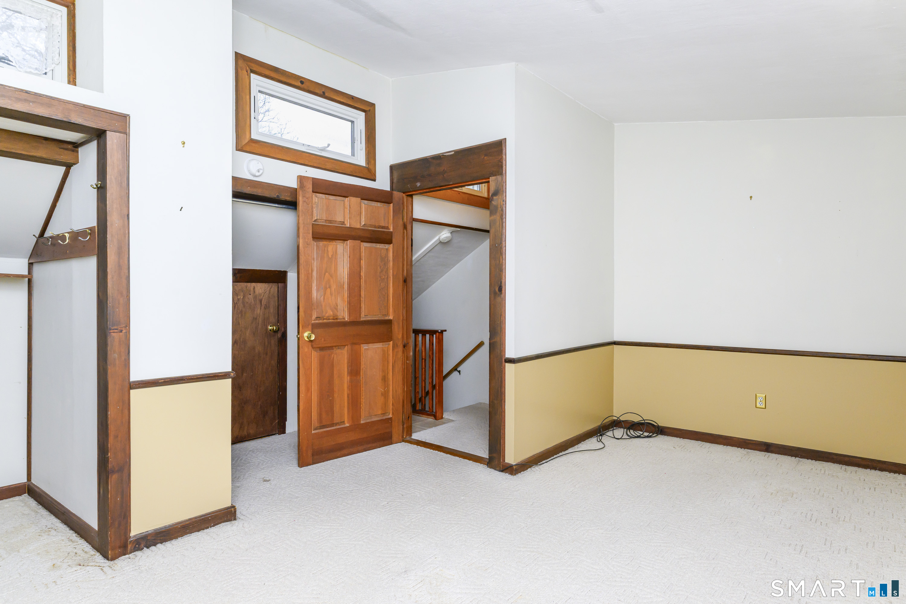39 Rocky Ledge Drive Clinton, CT 06413 - Photo 19 of 40 At the top of the stairs to the right is a bedroom with lovely light and plenty of closet space.