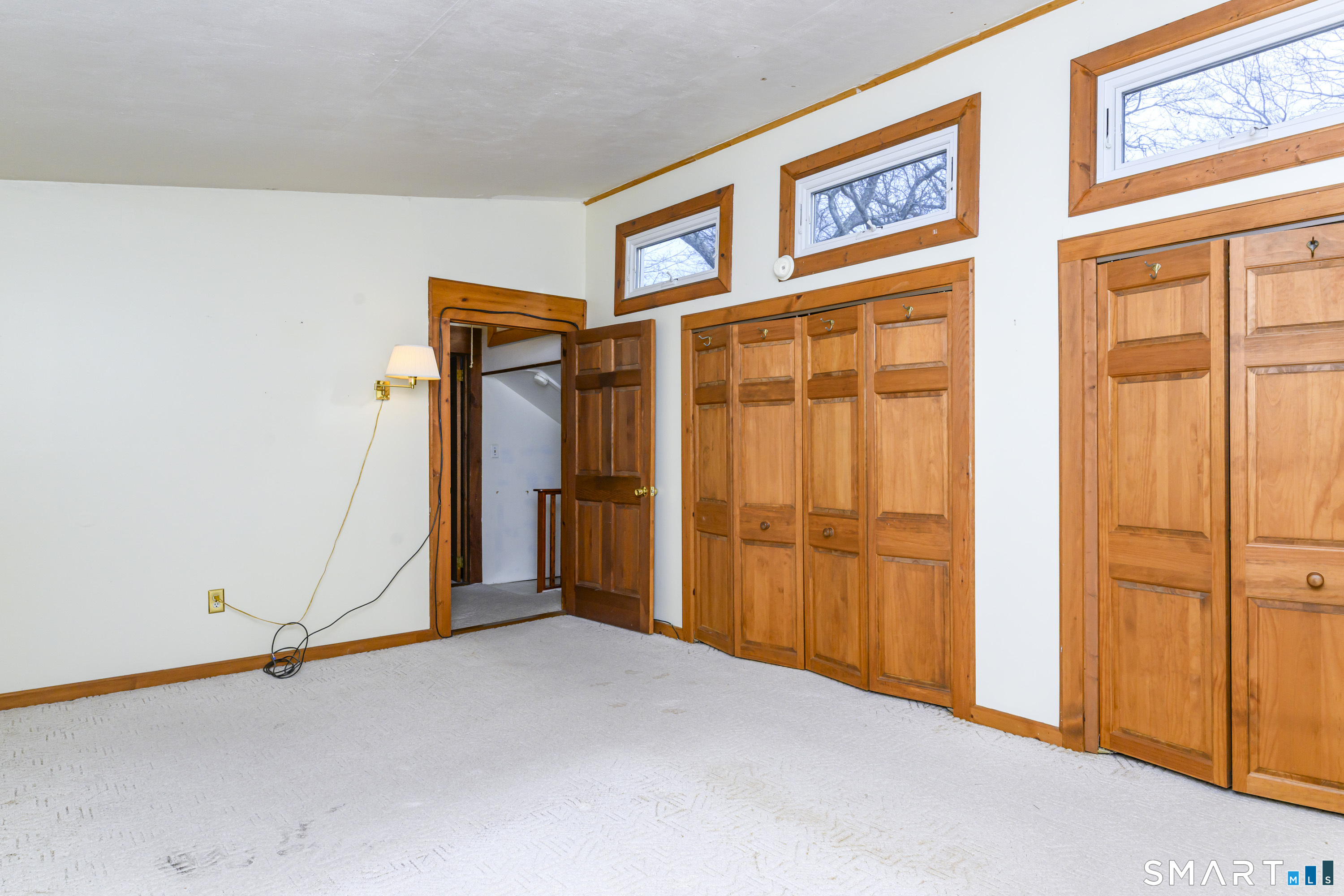 39 Rocky Ledge Drive Clinton, CT 06413 - Photo 24 of 40 Primary bedroom is also treated to wonderful light from the transom windows.