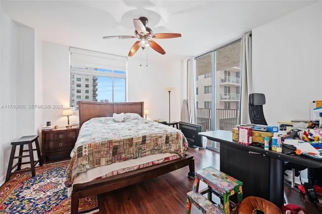 a bedroom with a bed furniture and a window