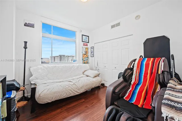 a bedroom with a bed and a couch