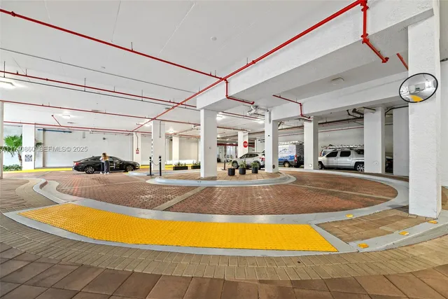 a view of a swimming pool with a dining table and chairs