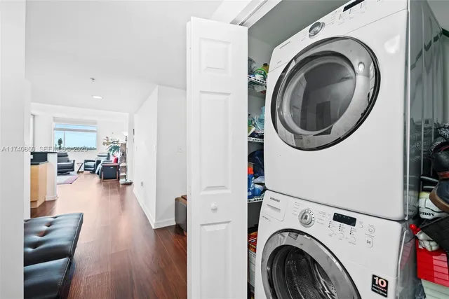 a view of a hallway with washer and dryer