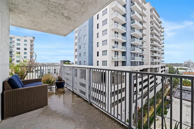 a view of a balcony with chairs