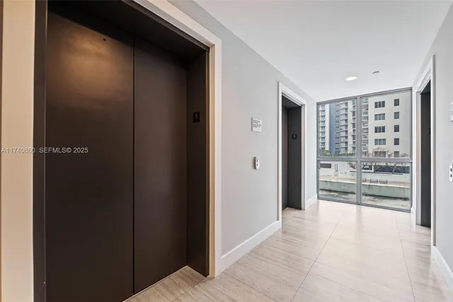 a view of hallway with a large window