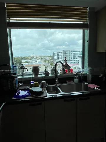 a kitchen with a sink and a stove