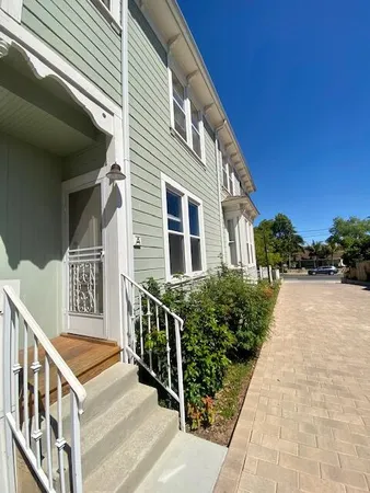 a front view of a house with stairs