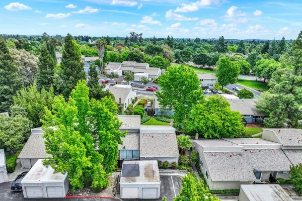 an aerial view of a house with outdoor space and street view