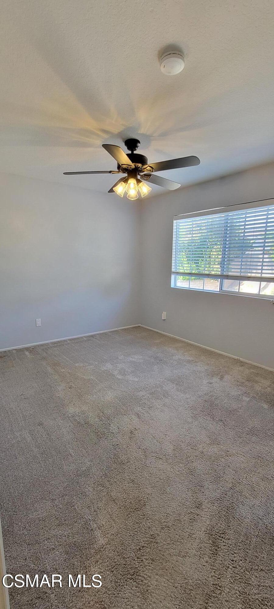 2708 Angel Circle Simi Valley, CA 93063 - Photo 12 of 26 an empty room with a window and a ceiling fan
