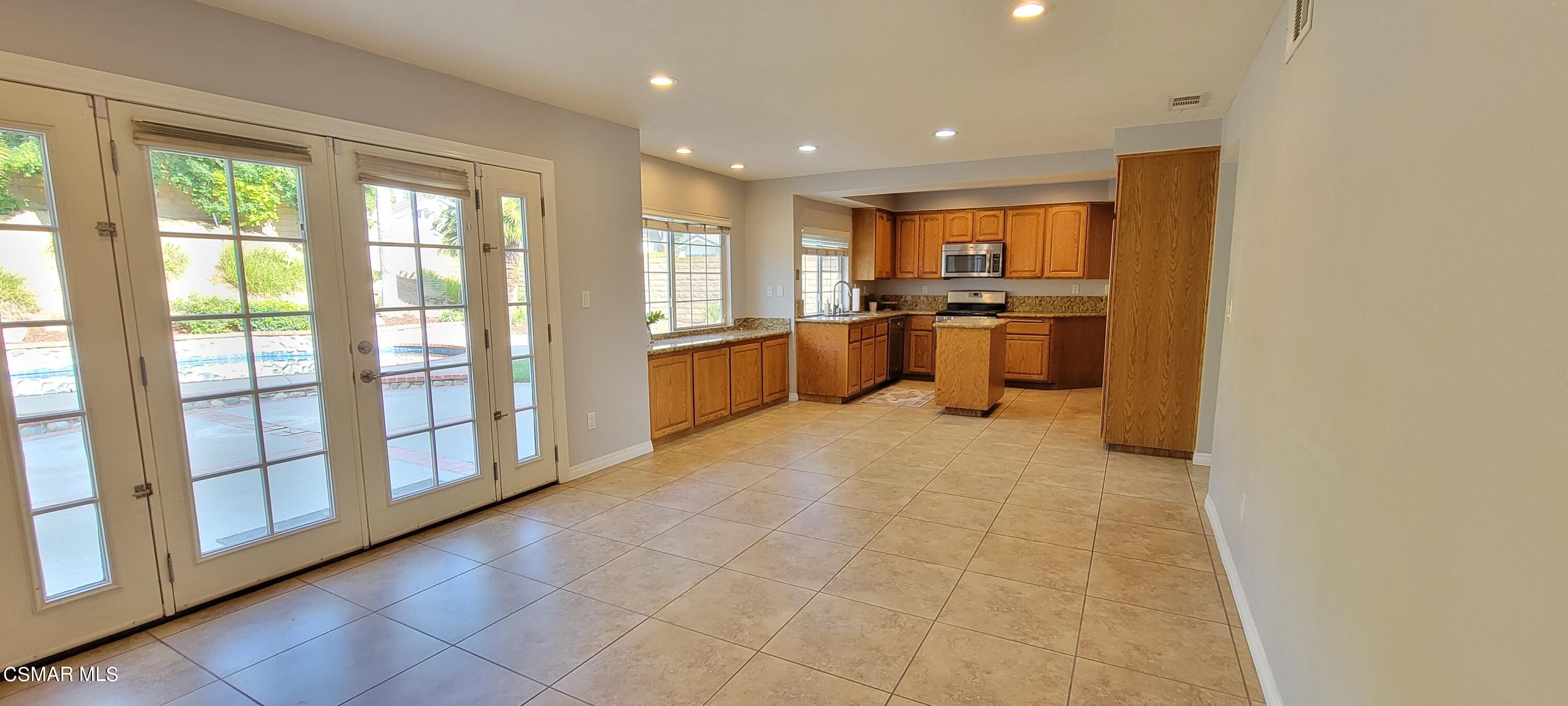 2708 Angel Circle Simi Valley, CA 93063 - Photo 7 of 26 a large white kitchen with a large window