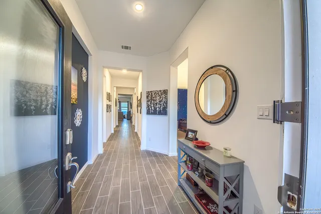 a bedroom with a bed and a mirror in it