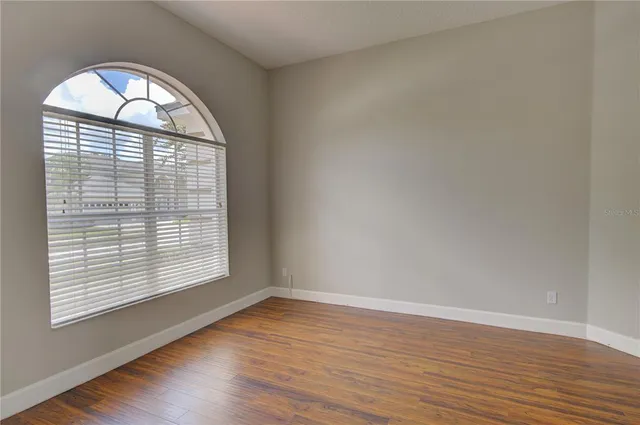 a view of a kitchen with a refrigerator and a sink