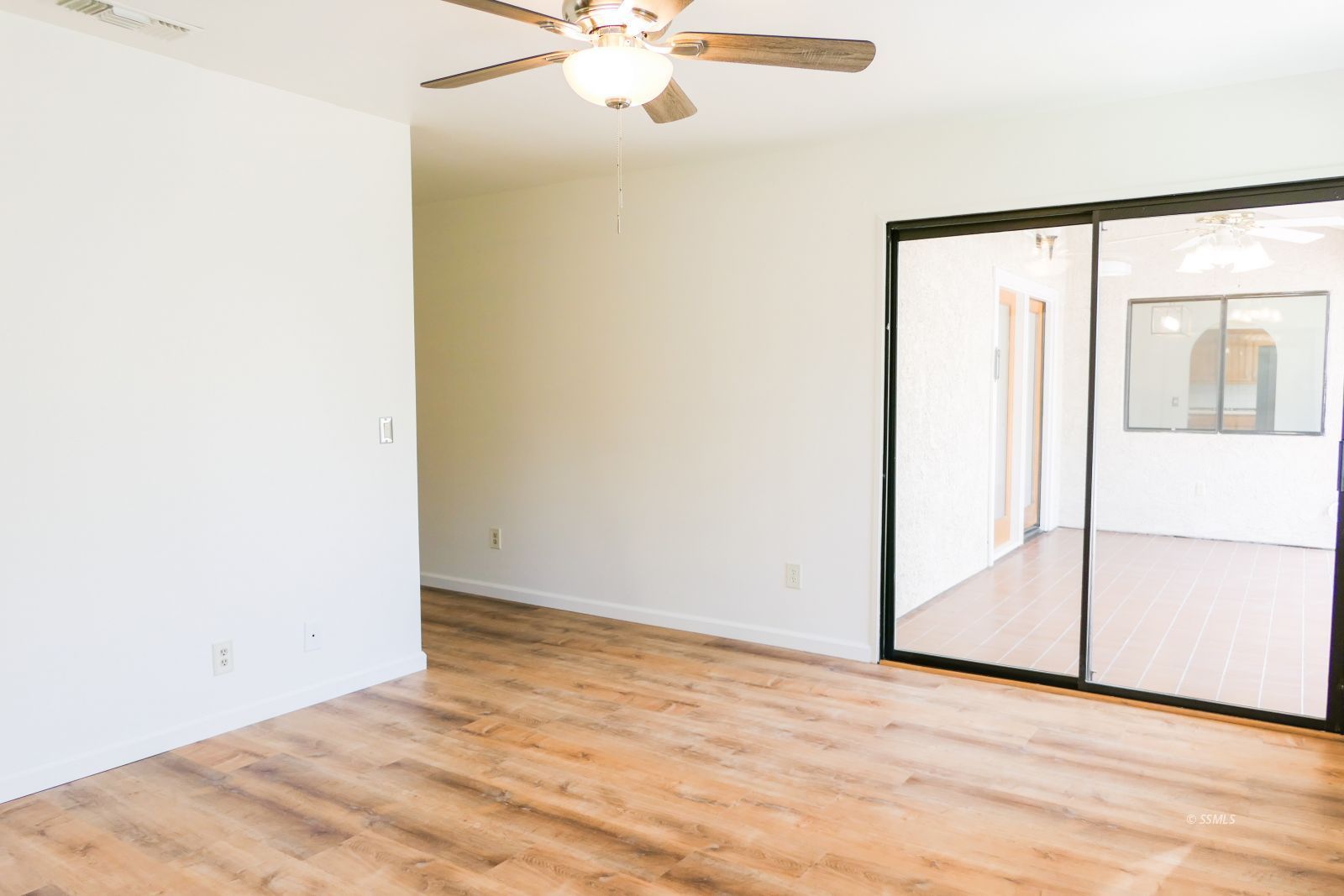 925 Hermosa Avenue Ridgecrest, CA 93555 - Photo 26 of 50 a view of an empty room with wooden floor
