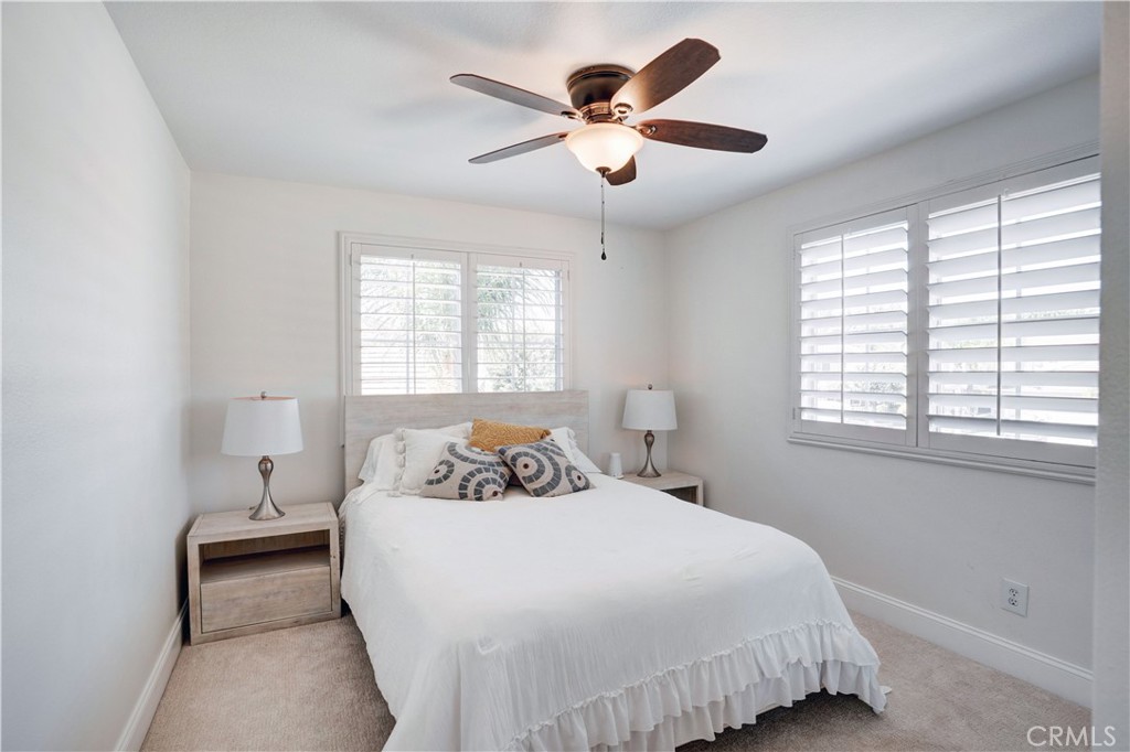 43041 Noble Court Temecula, CA 92592 - Photo 39 of 62 a bedroom with a bed and a large window