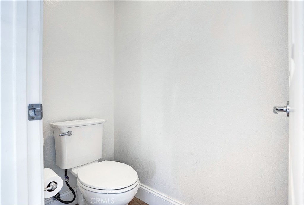 43041 Noble Court Temecula, CA 92592 - Photo 49 of 62 a white toilet sitting next to a white wall