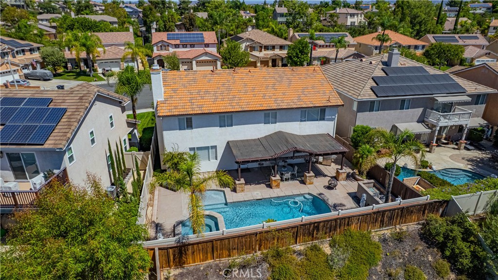 43041 Noble Court Temecula, CA 92592 - Photo 7 of 62 an aerial view of a house with swimming pool and outdoor seating