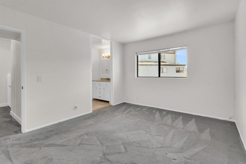 7321 Alicante Road, Unit A Carlsbad, CA 92009 - Photo 12 of 27 an empty room with windows