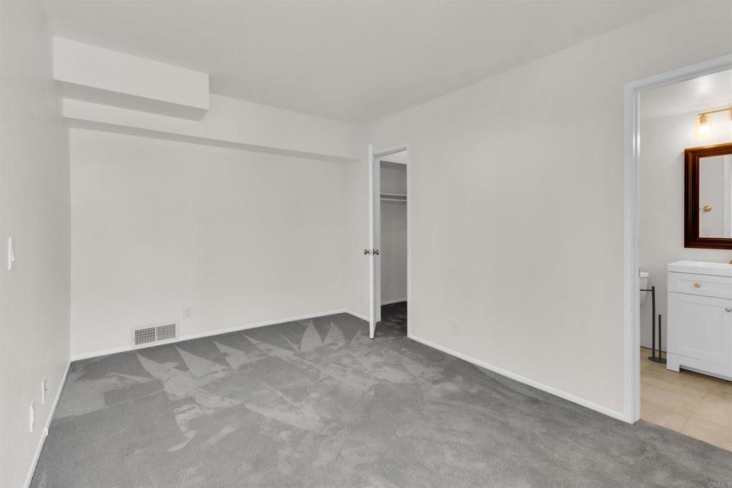 7321 Alicante Road, Unit A Carlsbad, CA 92009 - Photo 16 of 27 an empty room with washing machine and closet