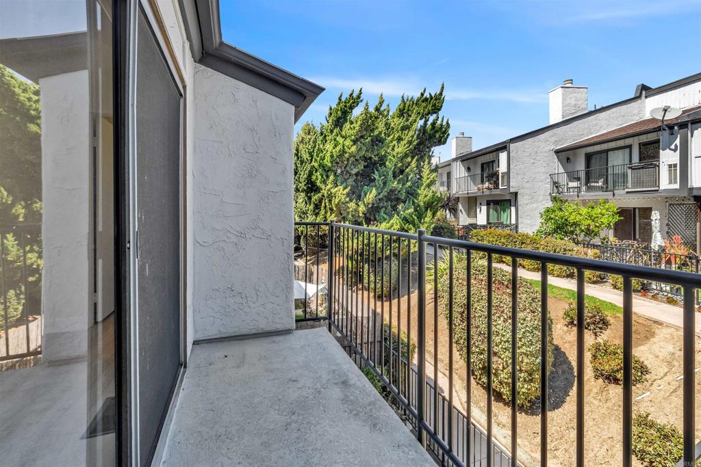 7321 Alicante Road, Unit A Carlsbad, CA 92009 - Photo 7 of 27 a view of a house with a balcony