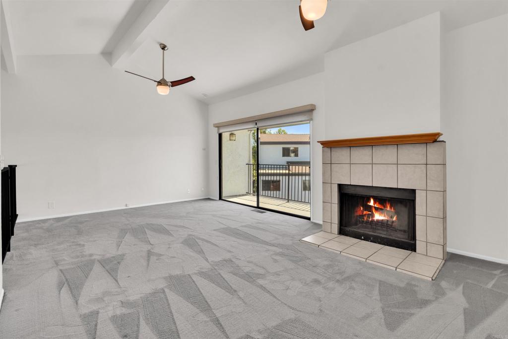 7321 Alicante Road, Unit A Carlsbad, CA 92009 - Photo 9 of 27 a living room with furniture and a fireplace