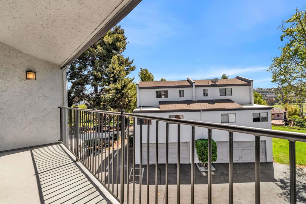7321 Alicante Road, Unit A Carlsbad, CA 92009 - Photo 10 of 27 a view of a balcony with wooden floor and fence and a porch