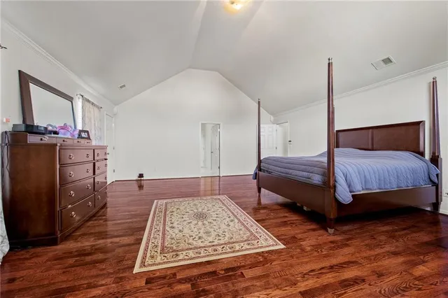 a bedroom with a bed and dresser